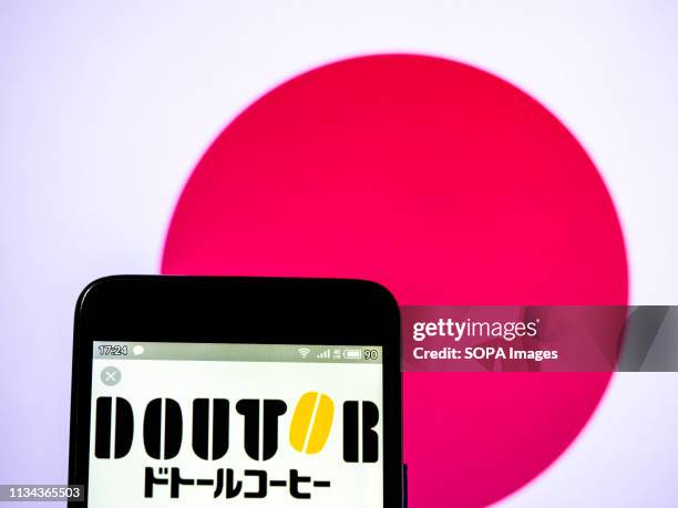 In this photo illustration a Doutor Coffee logo seen displayed on a smart phone.