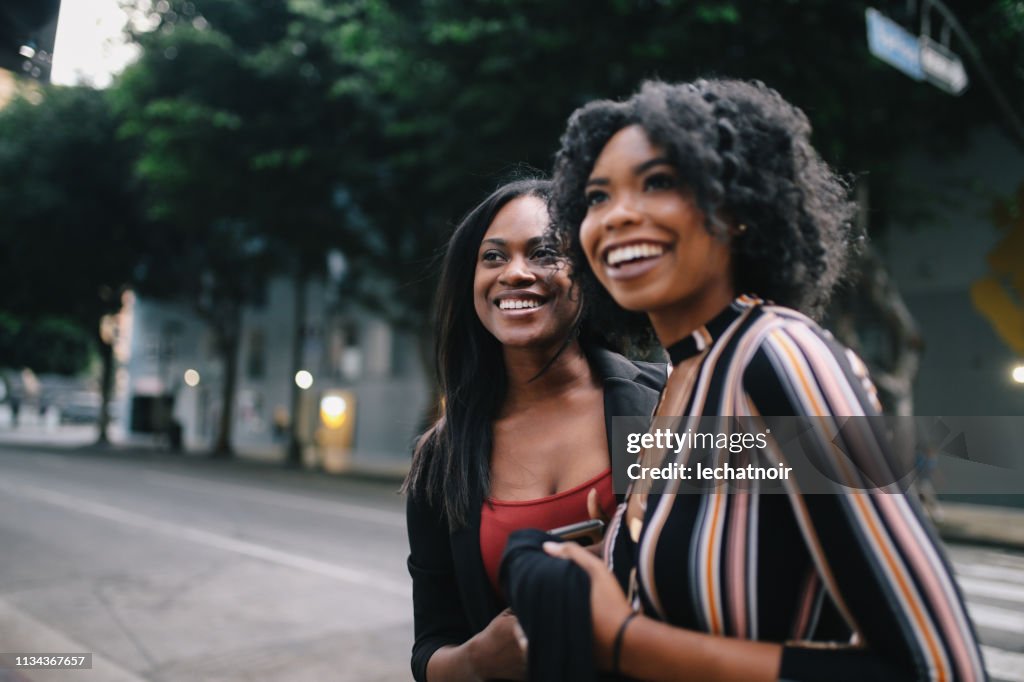 Two young female friends walking in downtown Los Angeles