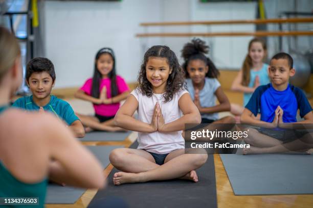 class meditation - kids meditating stock pictures, royalty-free photos & images