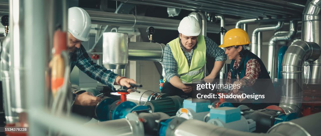 Technicians working in factory or utility