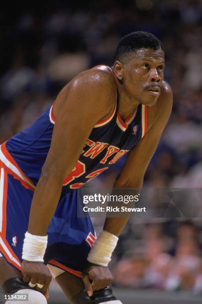 Patrick Ewing of the New York Knicks rests during an NBA game against the Milwaukee Bucks at the MECCA in Milwaukee, Wisconsin in 1988.
