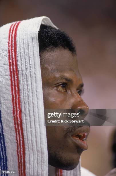 Patrick Ewing of the New York Knicks rests during an NBA game against the Milwaukee Bucks at the MECCA in Milwaukee, Wisconsin in 1988.