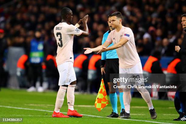 Diogo Dalot of Manchester United replaces teammate Eric Bailly as a substitute during the UEFA Champions League Round of 16 Second Leg match between...