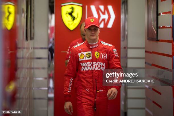 Mick Schumacher walks out of the garage after his first laps for Ferrari at the in-season test at the Sakhir circuit in the desert south of the...