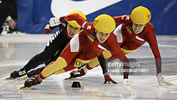 Wei Wang of China, Amelie Goulet-Nadon of Canada and Alanna Kraus of Canada skate in the women's 1000m finals at the ISU World CUP Short Track Speed...