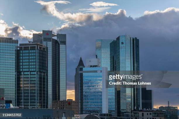 Office buildings, including the corporate headquarters of Deutsche Bank, stand in the financial district in the city center on March 7, 2019 in...