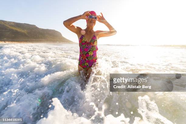 Senior woman going for a morning swim in the sea