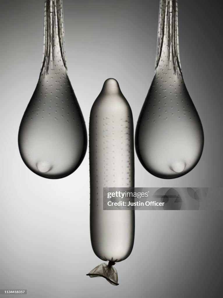 Still life of condoms suggesting male and female anatomy