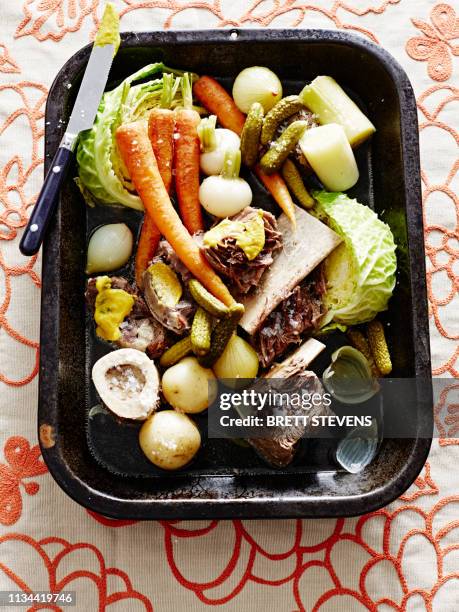 roasting tin of raw vegetable and meat for french pot au feu - ribs - pot au feu stock pictures, royalty-free photos & images