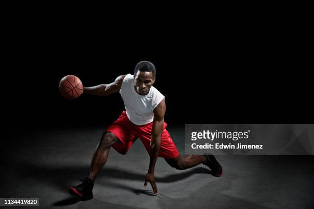 studio shot of basketball player with ball - 2013 usa basketball men stock pictures, royalty-free photos & images