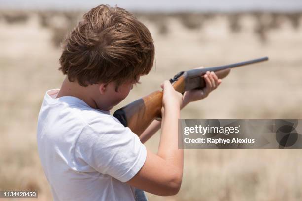 boy with rifle, texas, usa - texas independence stock pictures, royalty-free photos & images