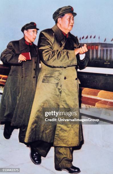 Mao Tse-Tung 1893-1976 1893-1976, Chinese Communist leader, centre, followed by LIN BIAO Chinese soldier and politician, holding the Little Red Book.