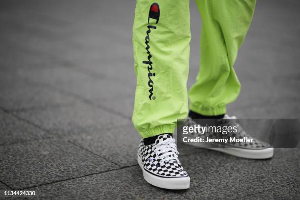 Richy Koll wearing Champion x Supreme pants and Vans shoes on March 07, 2019 in Berlin, Germany.