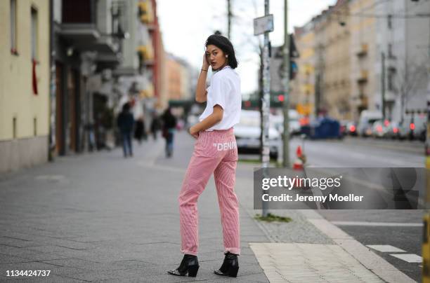 Anuthida Ploypetch wearing an Acne Studios shirt, Off White jeans on March 07, 2019 in Berlin, Germany.