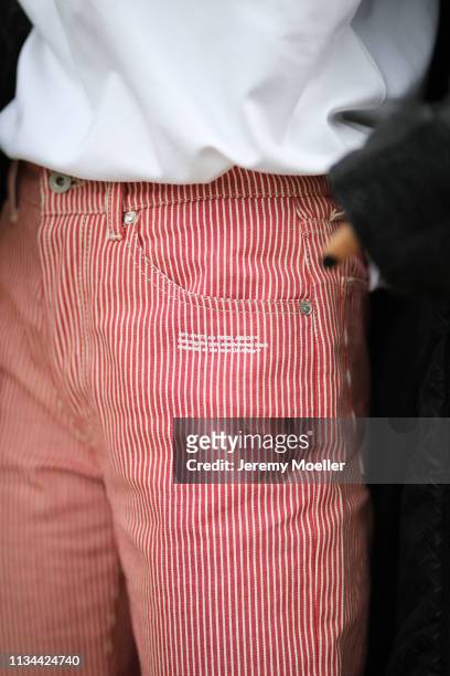 Anuthida Ploypetch wearing an Acne Studios shirt, Off White jeans and leather jacket on March 07, 2019 in Berlin, Germany.