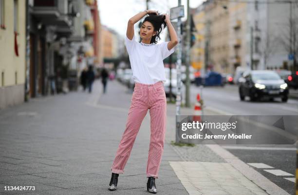 Anuthida Ploypetch wearing an Acne Studios shirt, Off White jeans on March 07, 2019 in Berlin, Germany.