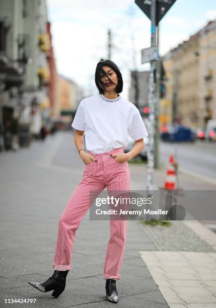 Anuthida Ploypetch wearing an Acne Studios shirt, Off White jeans on March 07, 2019 in Berlin, Germany.