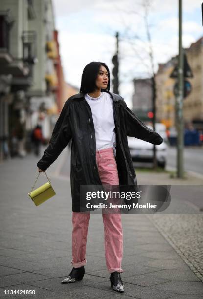 Anuthida Ploypetch wearing an Acne Studios shirt, Off White jeans and leather jacket on March 07, 2019 in Berlin, Germany.