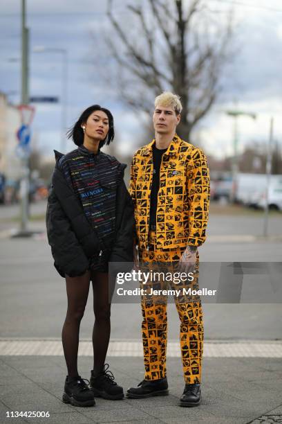 Anuthida Ploypetch and Richy Koll wearing a Balenciaga shirt, Buffalo shoes and Obey jacket and pants on March 07, 2019 in Berlin, Germany.