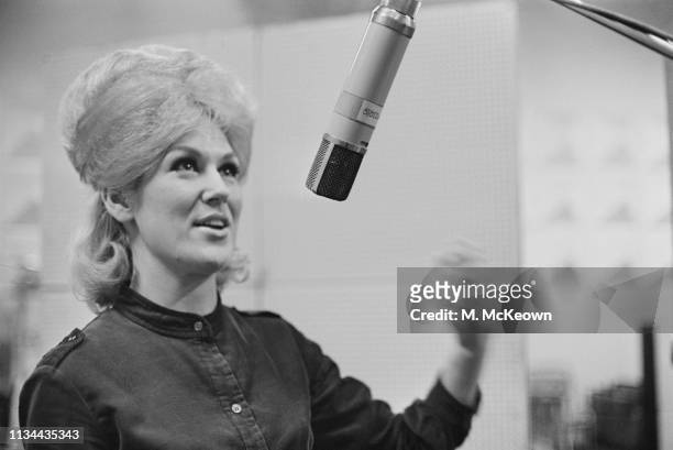 English singer and record producer Dusty Springfield recording her first solo single 'I Only Want to Be with You' at Olympic Studios, London, UK,...