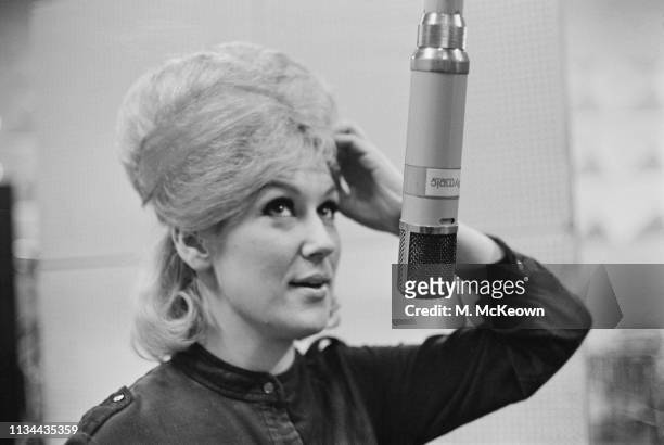 English singer and record producer Dusty Springfield recording her first solo single 'I Only Want to Be with You' at Olympic Studios, London, UK,...
