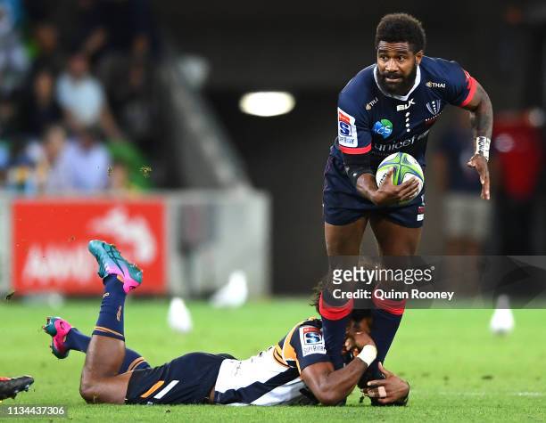 Marika Koroibete of the Rebels is tackled by Henry Speight of the Brumbies during the round four Super Rugby match between the Rebels and the...