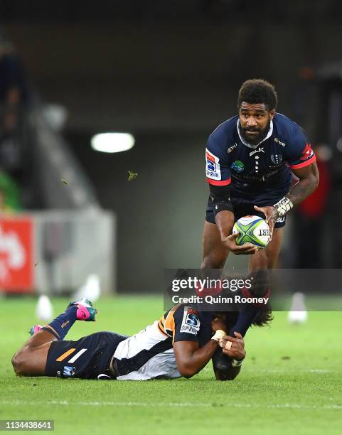 Marika Koroibete of the Rebels is tackled by Henry Speight of the Brumbies during the round four Super Rugby match between the Rebels and the...