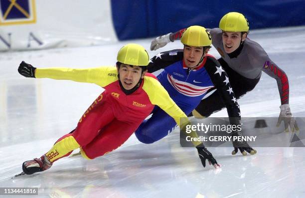 Jiajun of China takes the lead from Apolo Anton Ohno of the US and Eric Bedard of Canada 11 March 2000, to win men's 500m quarter final during the...