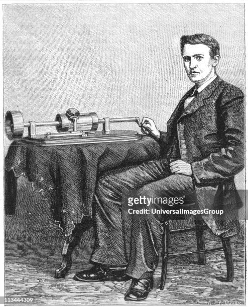 Thomas Alva Edison American inventor, with early hand-driven model of his phonograph. Engraving published 1878