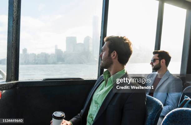 usa,new york city, two businessmen on passenger deck of a ferry - commuter ferry stock pictures, royalty-free photos & images