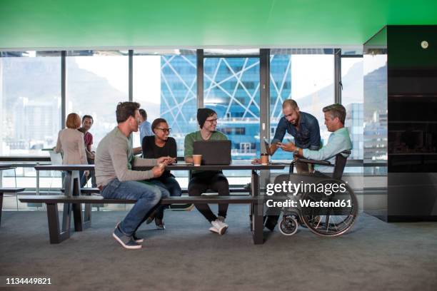 group of people having a meeting in modern office - dramatic millennials stock pictures, royalty-free photos & images