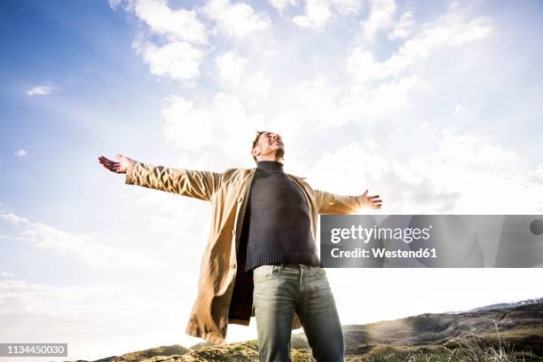 Outstretched 7,521 Arms Outstretched Low Angle View Stock Photos, High-Res Pictures ...