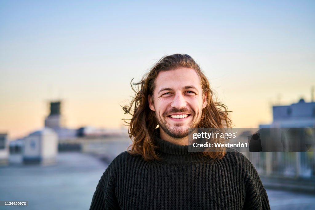 Portrait of bearded young man smiling