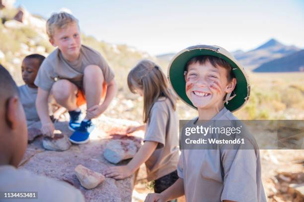 portrait of happy boy at a camp - girl scout stock-fotos und bilder