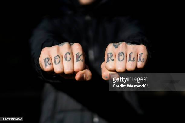 man showing his tattooed hands, close-up - tattoo fotografías e imágenes de stock