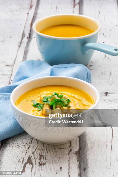 bowl of sweet potato soup with mango, curcuma and coconut milk, croutons and basil - mashed sweet potato imagens e fotografias de stock