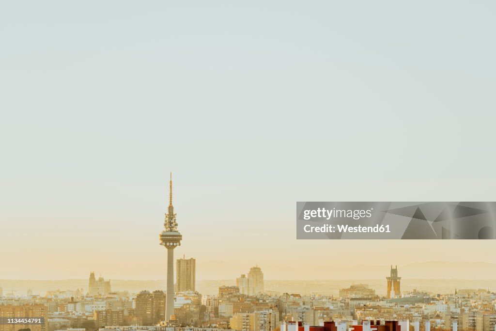Spain, Madrid, skyline with television tower at dawn