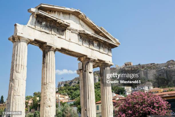 greece, athens, roman agora, gate of athena archegetis with view to acropolis - agora stock pictures, royalty-free photos & images