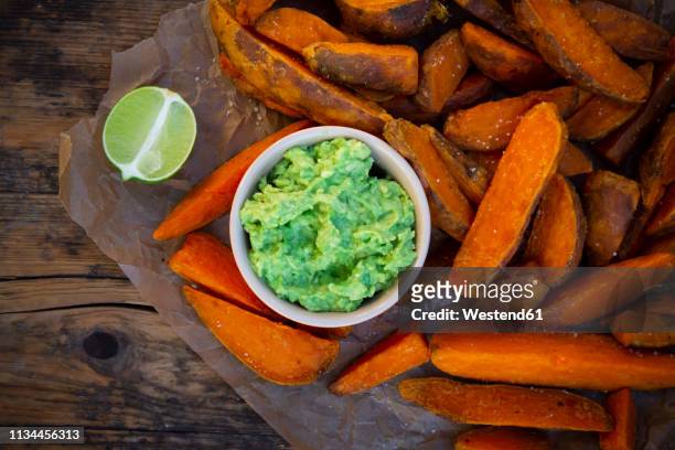 sweet potato wedges with avocado dip - cheese wedge foto e immagini stock