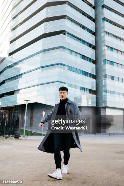 spain, barcelona, stylish young man posing on the street - menswear stock pictures, royalty-free photos & images