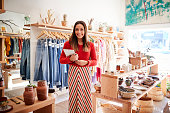 Portrait Of Female Owner Of Independent Clothing And Gift Store With Digital Tablet