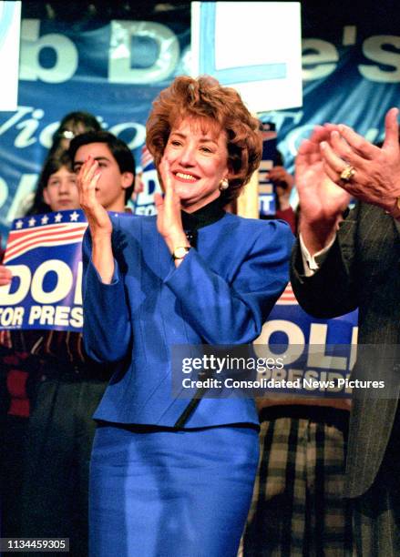 American former politician Elizabeth Dole applauds during a Presidental campaign rally for her husband , Nashua, New Hampshire, February 17, 1996.