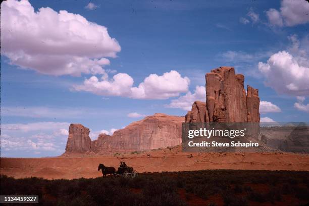 Scene from 'Once Upon a Time in the West' of a horse-drawn wagon in Monument Valley, Arizona, 1967. In the wagon is Tunisian-born Italian actress...