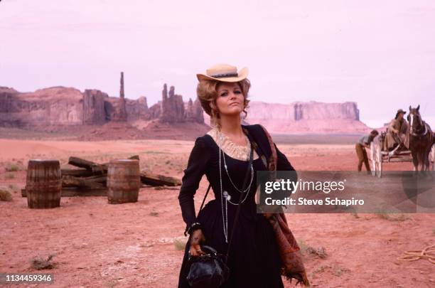Portrait of Tunisian-born Italian actress Claudia Cardinale as she poses, in costume, and on location in Monument Valley for the film 'Once Upon a...