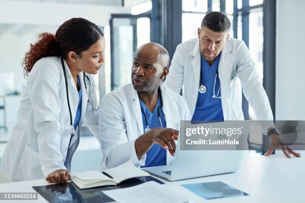 we should research more about this infection - hospital team with patient stock pictures, royalty-free photos & images