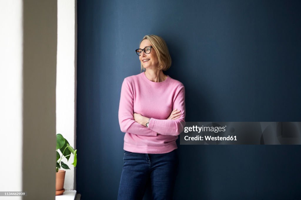 Portait of confident mature woman at home