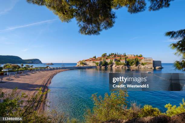 montenegro, adriatic coast, hotel island sveti stefan and beach, near budva - montenegro stock pictures, royalty-free photos & images