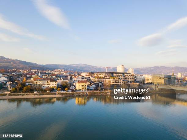 austria, linz, view to the city with danube river in the foreground - linz stock-fotos und bilder