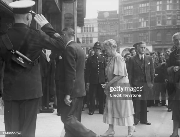 Queen Mary arriving at the Odeon cinema, Leicester Square, London, 11th August 1945. The Queen saw the films 'It's a Pleasure!', starring Sonja Henie...