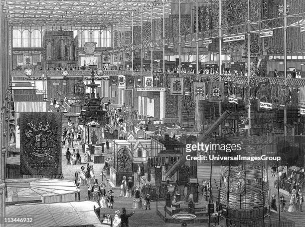 Great Exhibition of 1851 in the Crystal Palace, Hyde Park, London: interior view of the main avenue looking eastwards. The iron framework of the...